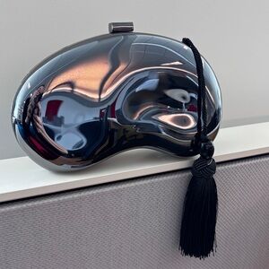 Metallic Bean Shape Clutch With Tassel